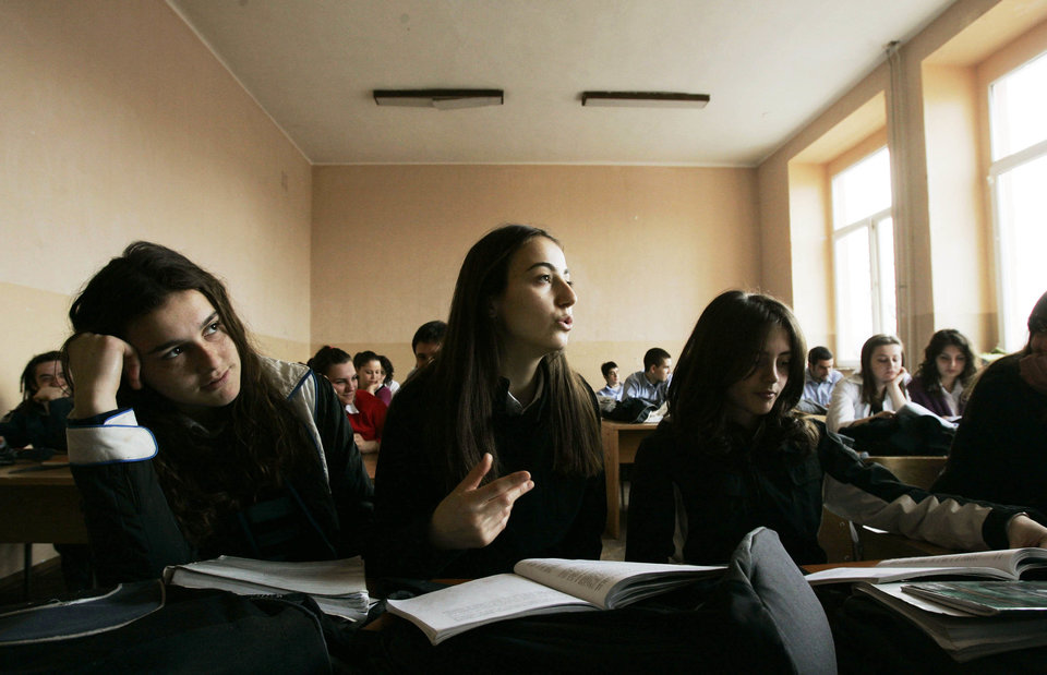 PRISTINA, SERBIA - MARCH 15: A Kosovo Albanian girl answers a question in a sociology class at Sami Frasheri high school March 15, 2007 in Pristina, Serbia. Young people under 25-years-old represent 60 per cent of the population of Kosovo, one of the highest percentages of youth in Europe. Residents of Kosovo are anxiously awaiting moves this year to formalize independence from Serbia, a move backed by nearly all ethnic Albanians in the Serbian province. Sami Frasheri was a leading Albanian poet in the 19th century. (Photo by Chris Hondros/Getty Images)