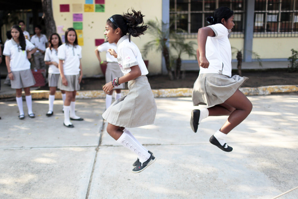 Children play during a break after returning to school following a two-months strike of teachers due to criminal threats, in Acapulco, Mexico, on January 27, 2015. AFP PHOTO/PEDRO PARDO (Photo credit should read Pedro PARDO/AFP/Getty Images)